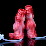 Two red silicone cock sleeves with glossy textured pattern and open tops