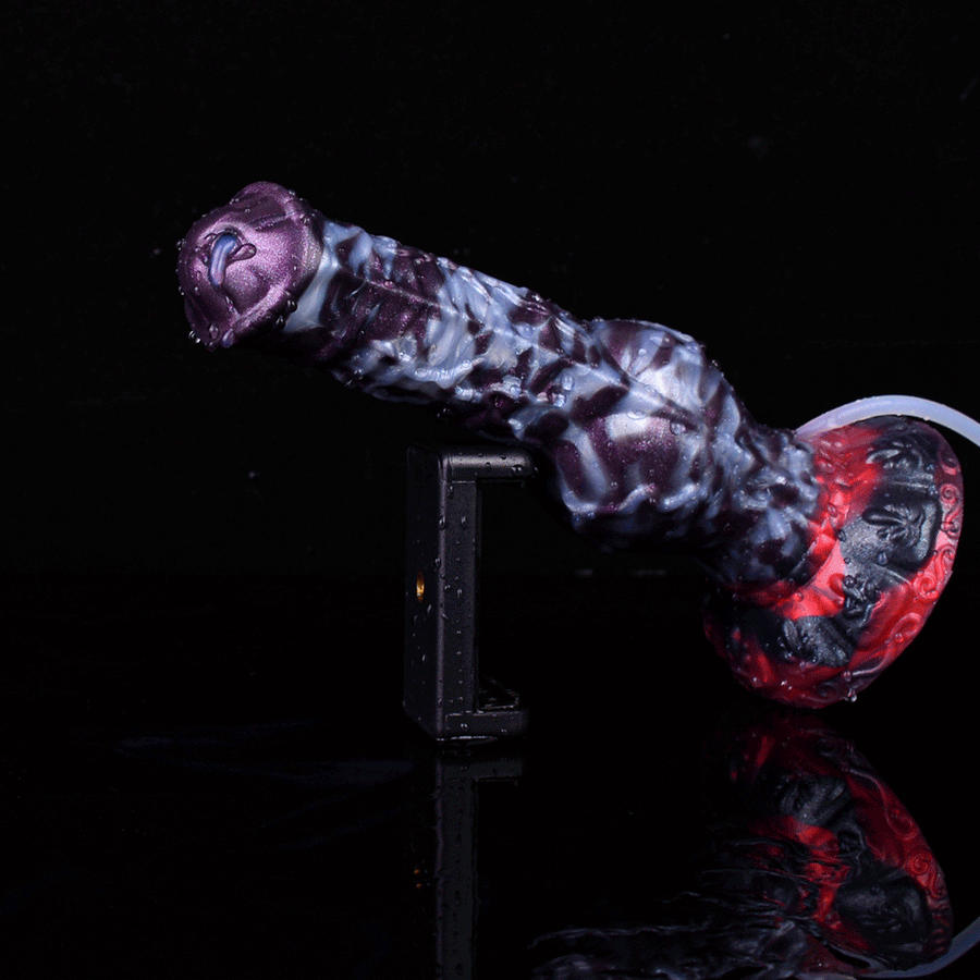 Purple textured squirting dildo with red knot base and attached white tube