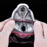 Overhead view: two-hole horse stroker opening with pink inner details