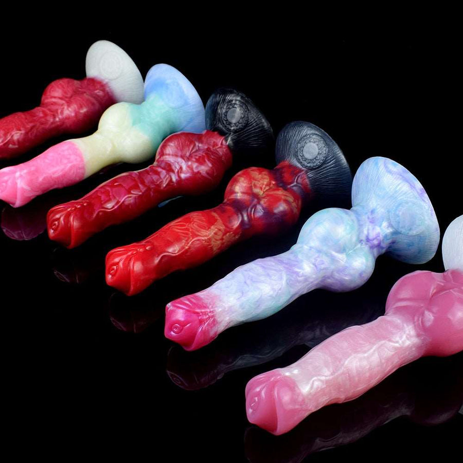 Assorted realistic canine dog dildos with knots, laid out in red, pink, and blue tones