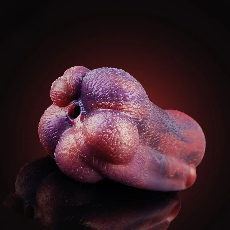 Purple and pink animal-shaped adult sex toy with textured surface and opening on head
