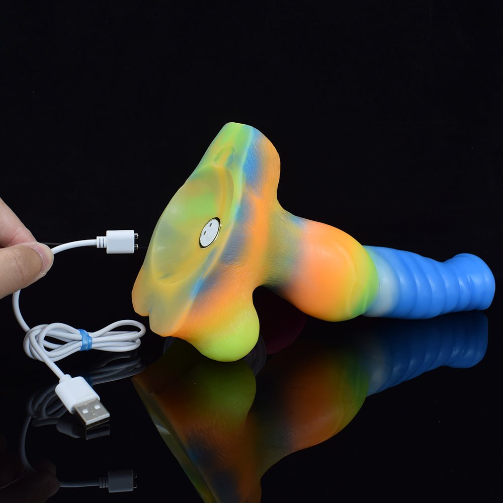 Giant Wolf-Vibrator mit leuchtender, regenbogenfarbener Oberfläche und USB-Kabel