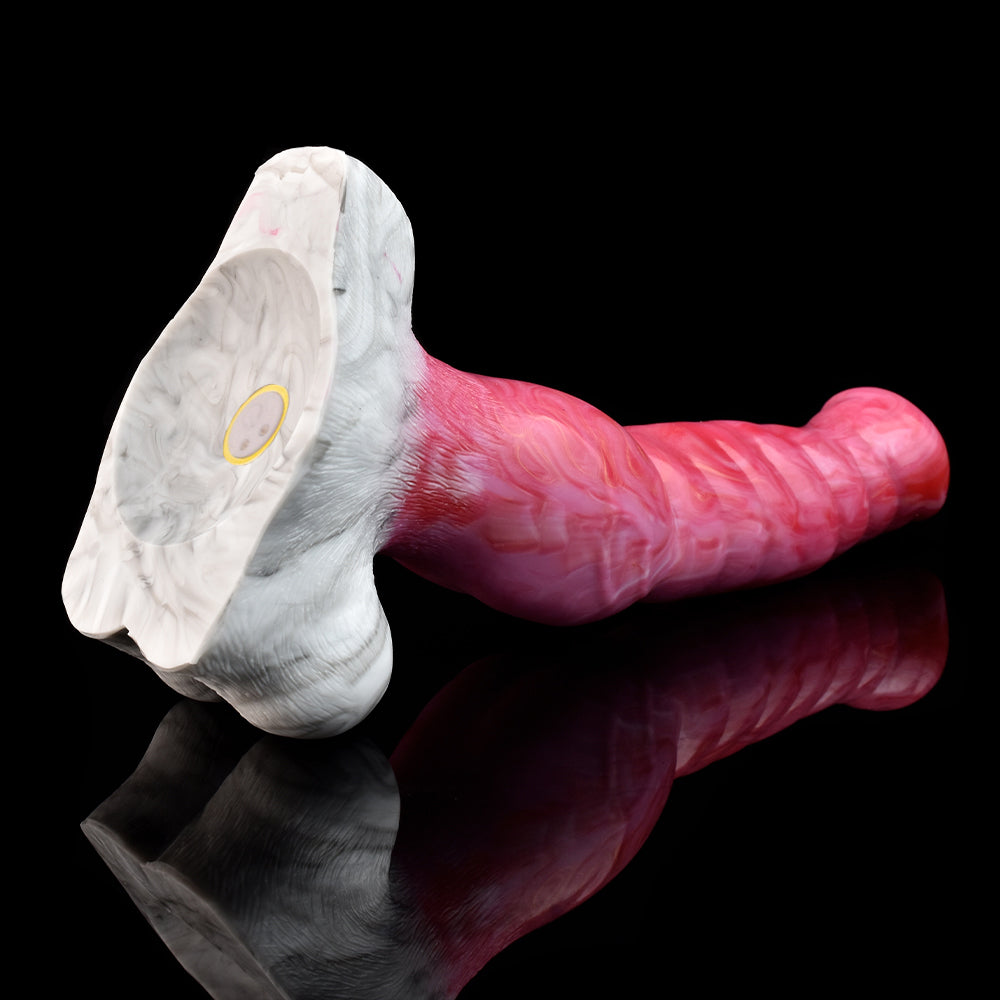 Close view of wolf vibrator head and tail, white base with pink textured shaft