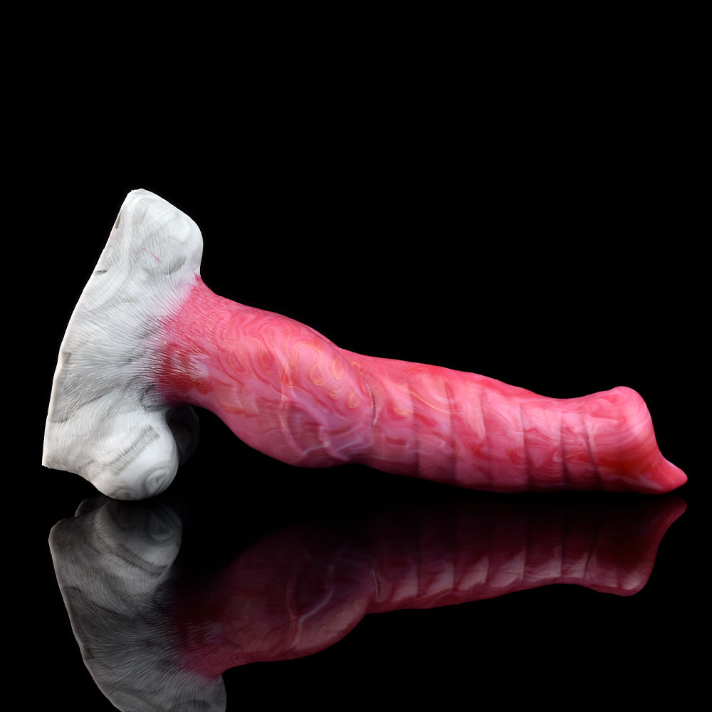 Canted view of pink wolf-shaped vibrator, white faux-fur base
