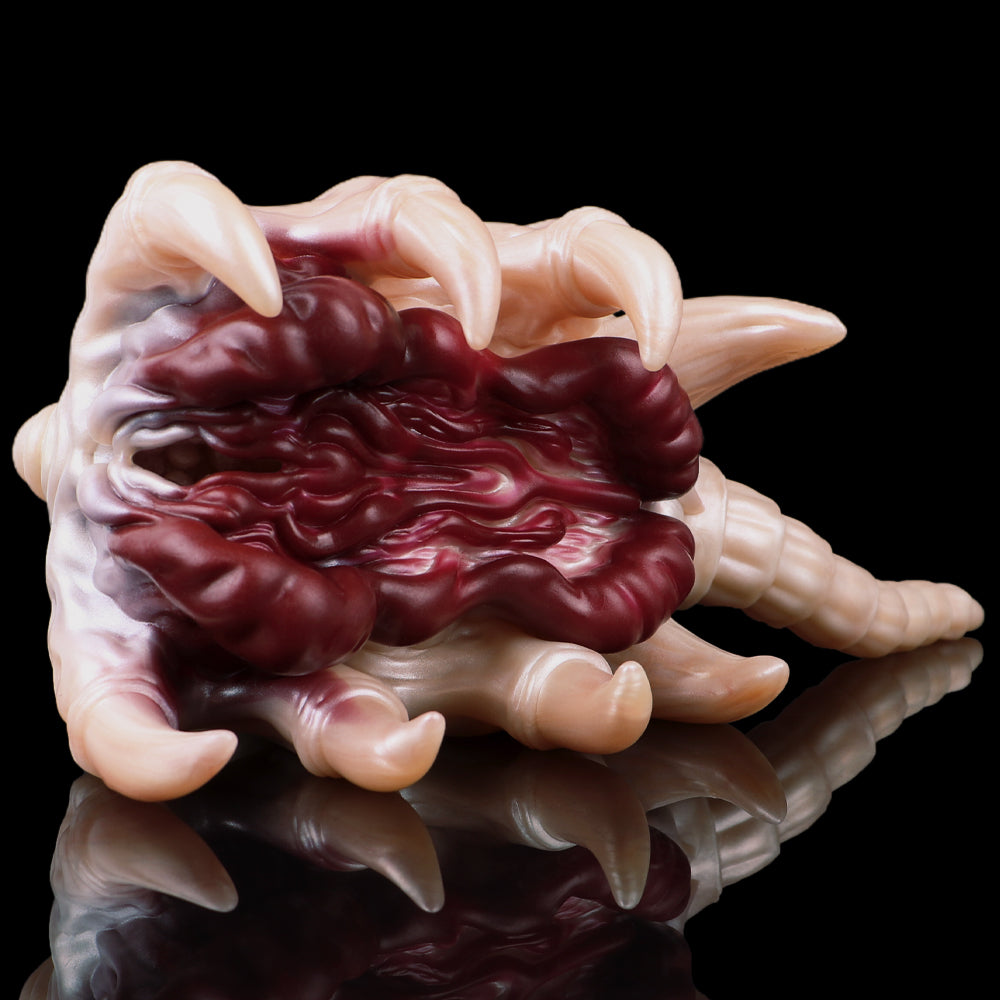 Facehugger-style fleshlight, side view of red wrinkled interior tentacles