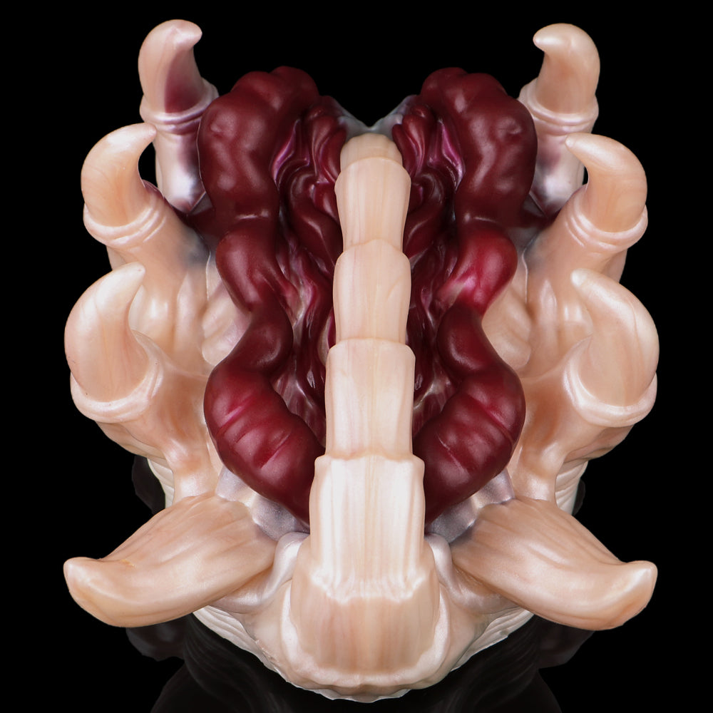 Facehugger fleshlight back/underside with maroon central grip and pale claw tips