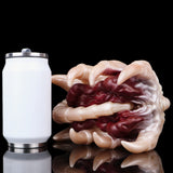 Facehugger fleshlight angled view with pale claws and maroon inner tentacle texture