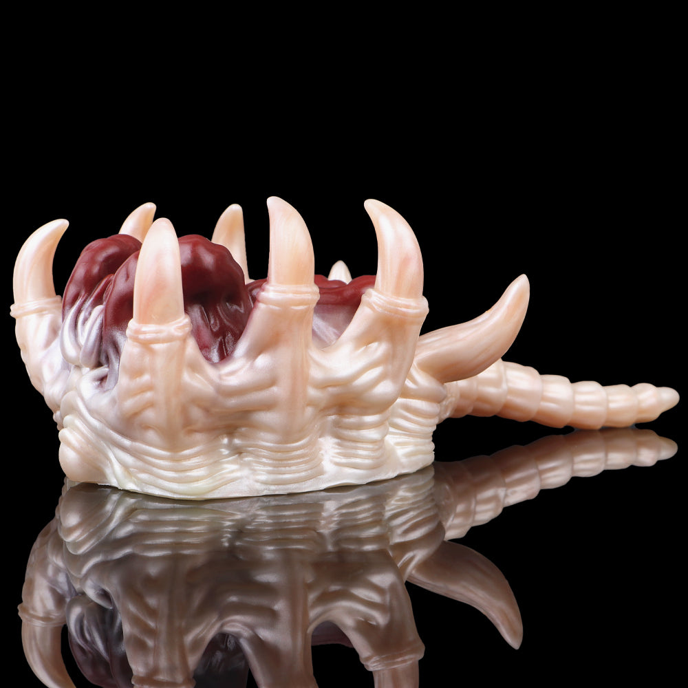 Facehugger fleshlight long grip with pale tentacles, maroon interior core, multiple tips