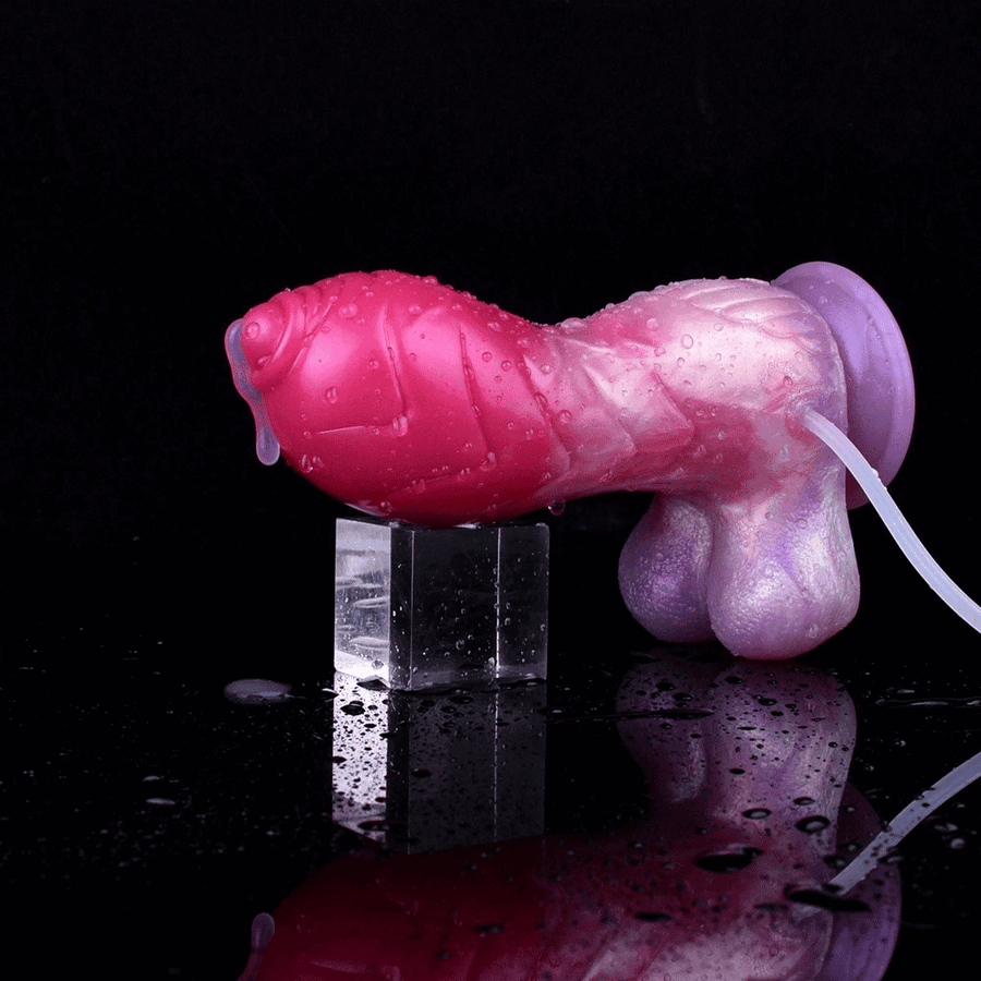 Unicorn-themed squirting dildo with magenta and purple finish, curved shape, suction base
