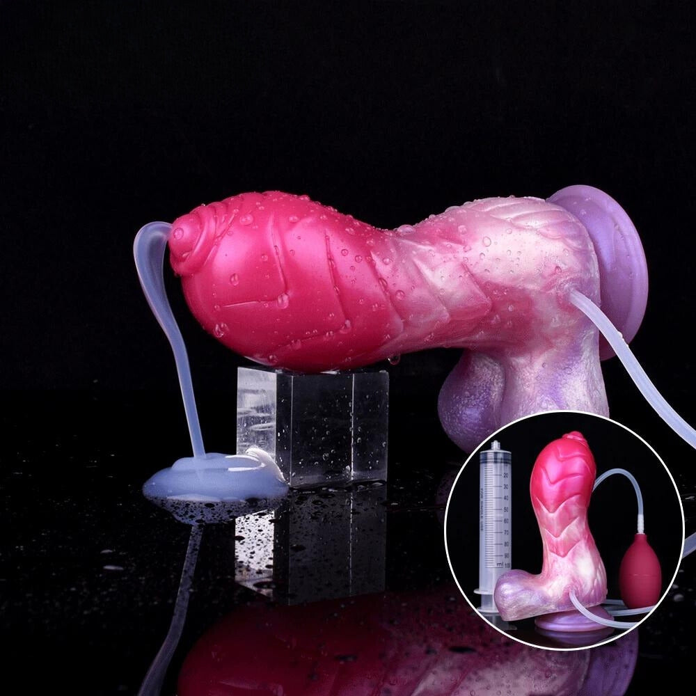 Pink-and-purple unicorn squirting dildo with clear tube, plus suction base on support.