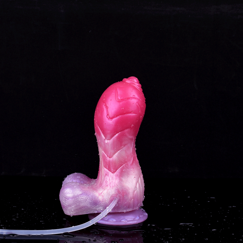 Pink unicorn squirting dildo with round suction cup base and curved nozzle.