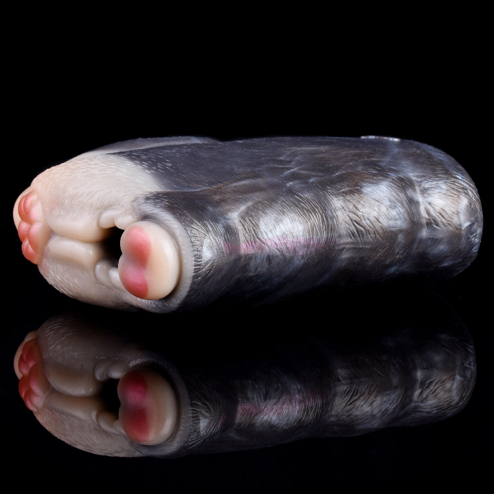 Fawn-shaped silicone sex toy, side profile with mottled gray and cream texture