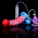 Rosa Pferde-Dildo mit rotem Kopf und blauer Basis; Messzylinder und Schlauch angeschlossen