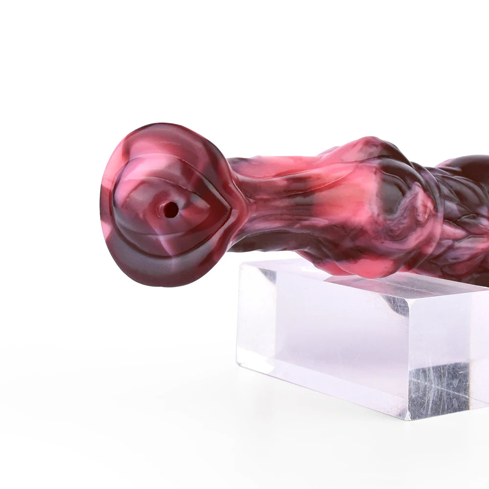 Close-up horse-shaped dildo head, marbled pink and dark, small opening and knot area