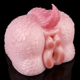 Pink dragon-themed toy from side angle with textured body and molded nozzle