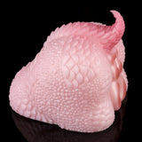 Pink dragon-shaped dual-ended toy close side view with textured scale pattern