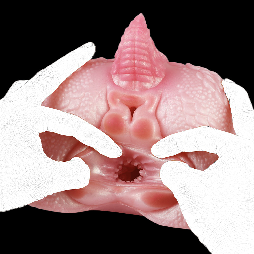 Pink dragon-shaped toy with two-hand grip and visible inner opening