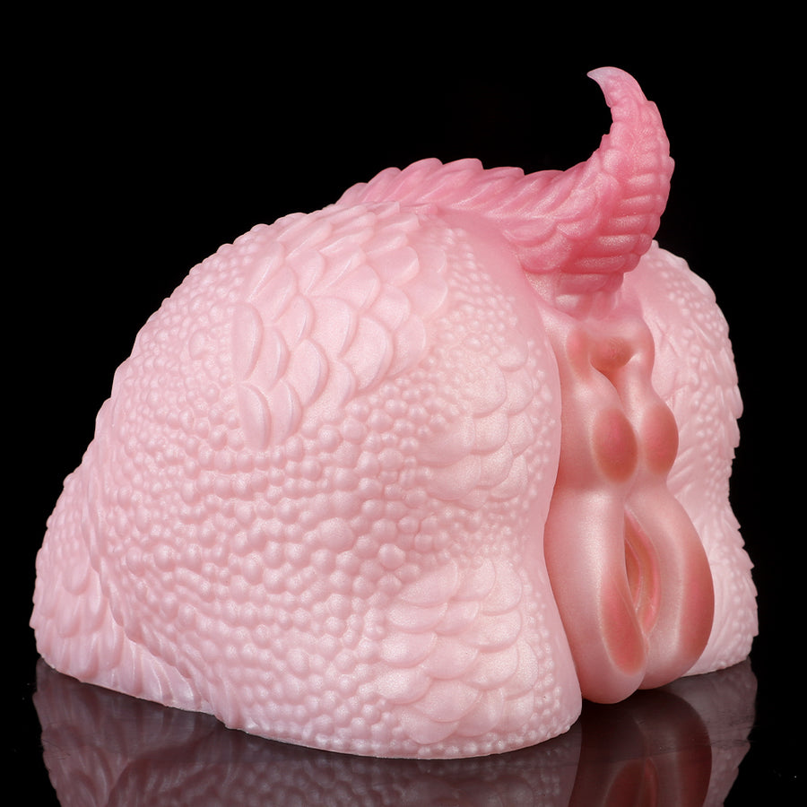 Pink dragon fleshlight, front-side view with textured scales and dual openings
