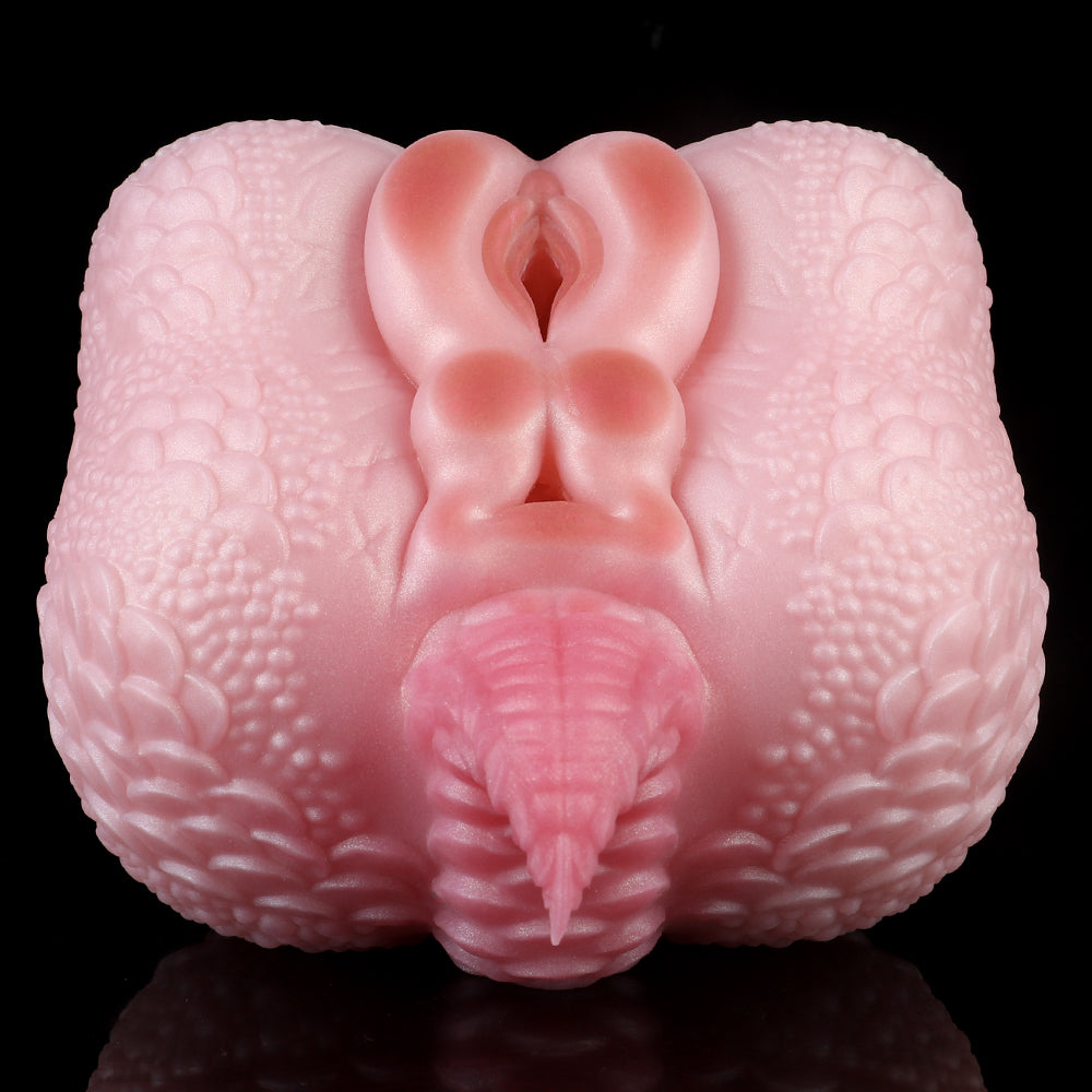 Pink dragon-shaped toy front view with central opening and raised details