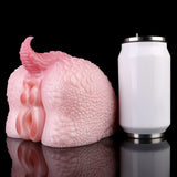Pink dragon-themed dual-ended toy next to a small cylinder container