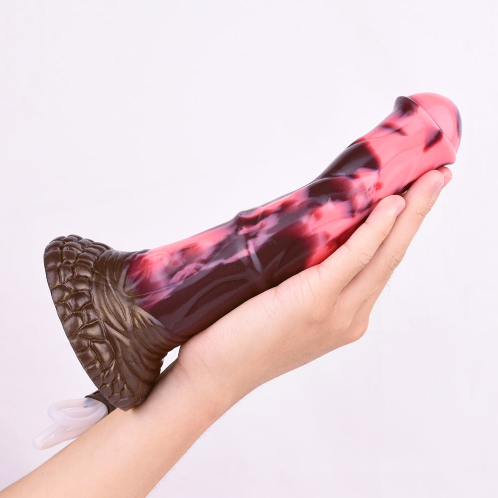 Marbled pink/dark horse dildo held in hand; curved shape with textured brown base
