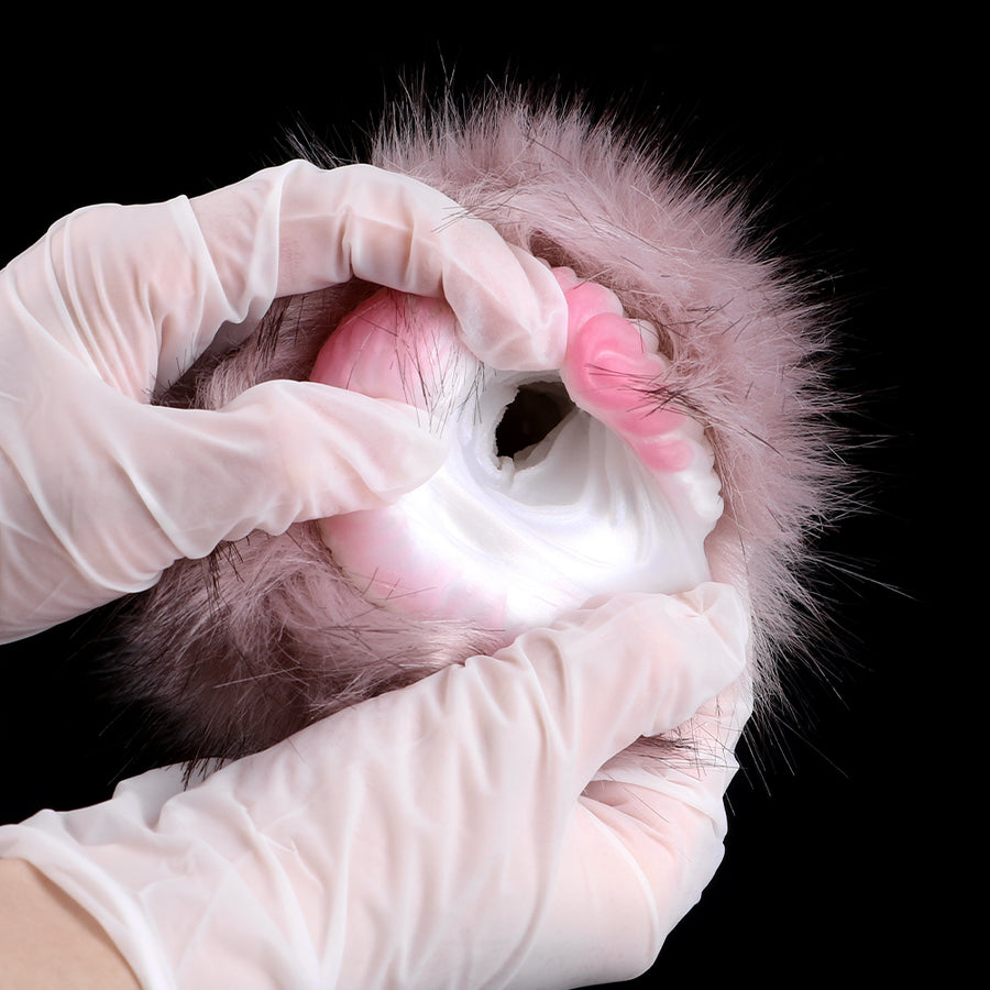 Furrina furry masturbator with pink inner insert, white-gloved hands reaching into opening