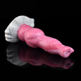 Pink dog-style vibrating toy with textured white muzzle plate and base