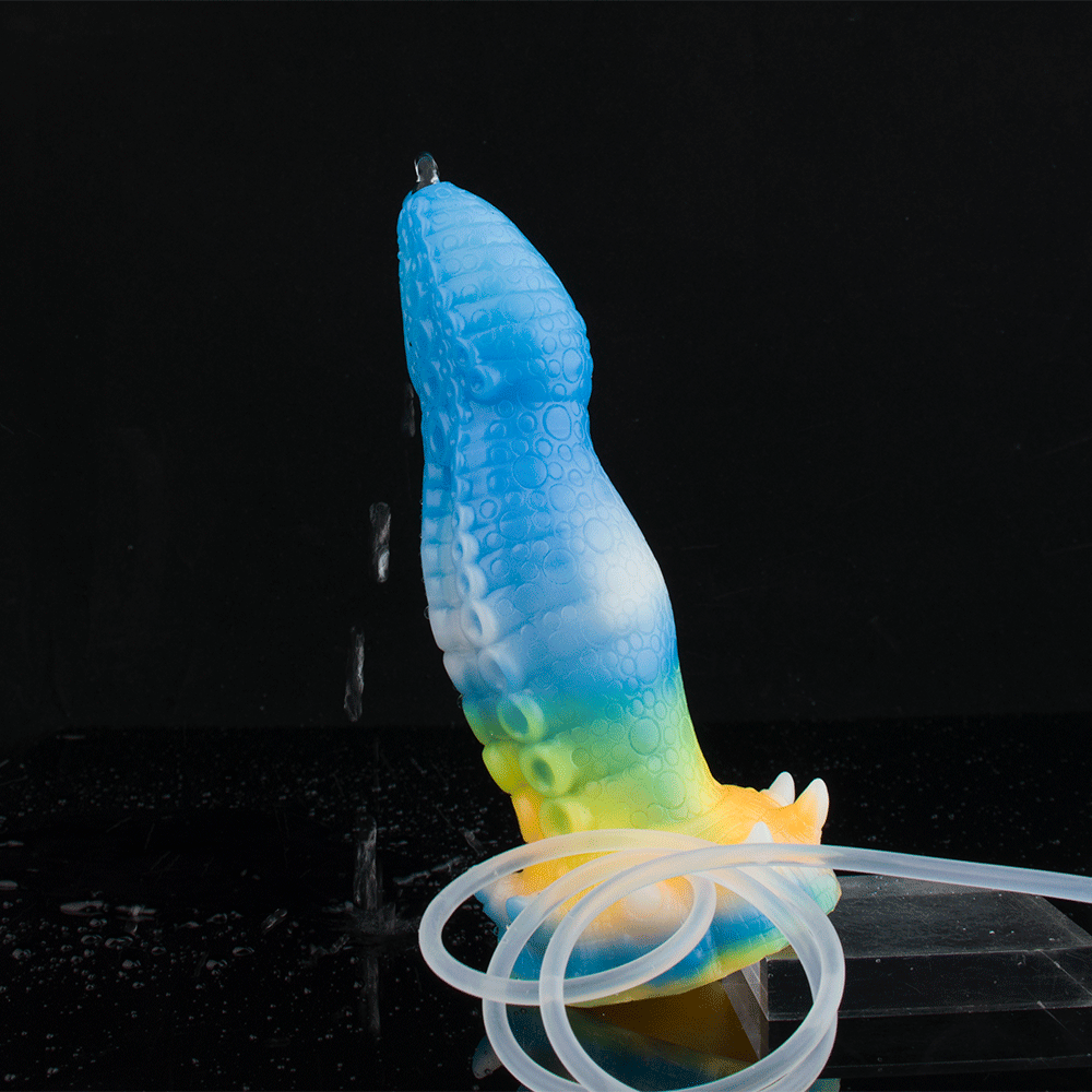 Blue and rainbow octopus vibrator, clear syringe-style tube and charging accessories