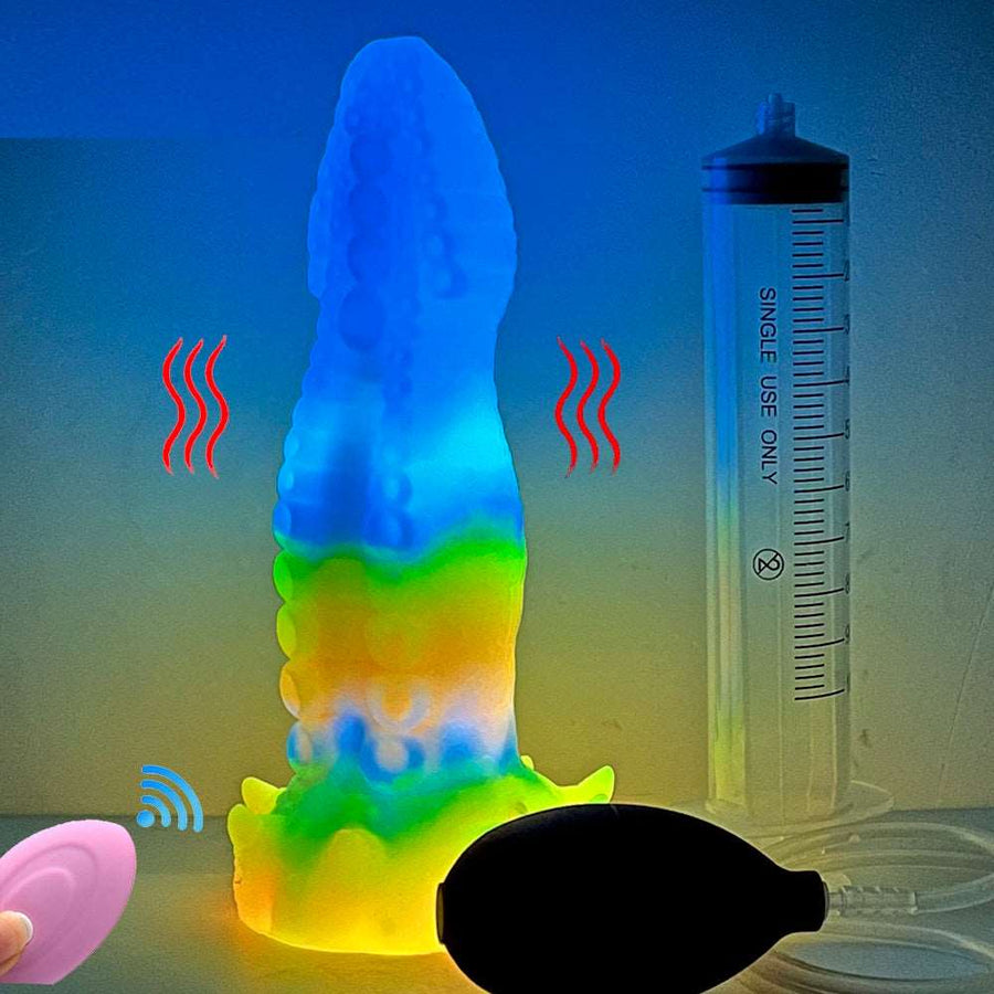 Glowing octopus vibrator next to water-measuring tube and small pink remote controls