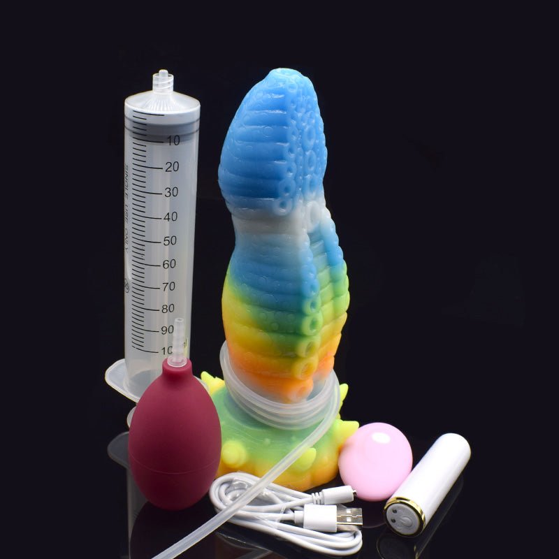 Glowing octopus vibrator with pink remote, clear tubing, and charging cable