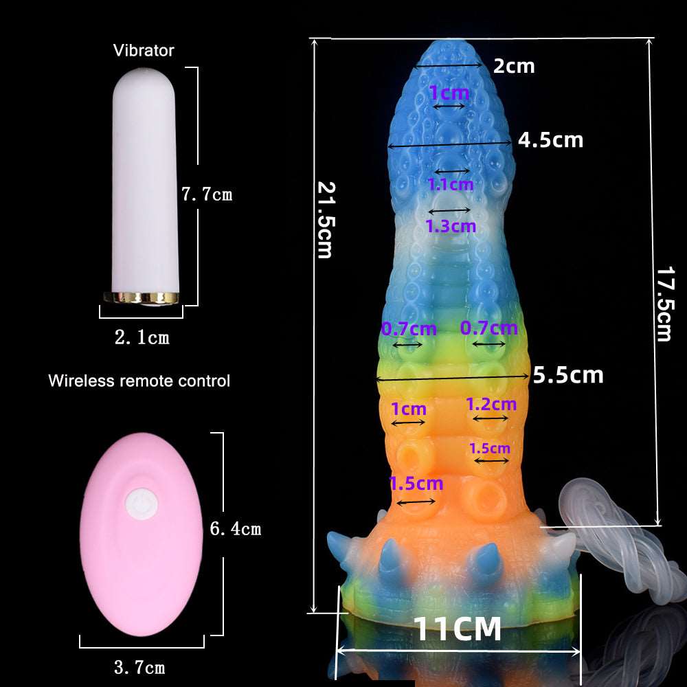 Glowing octopus vibrator with tube, water droplets visible, blue-green-yellow body