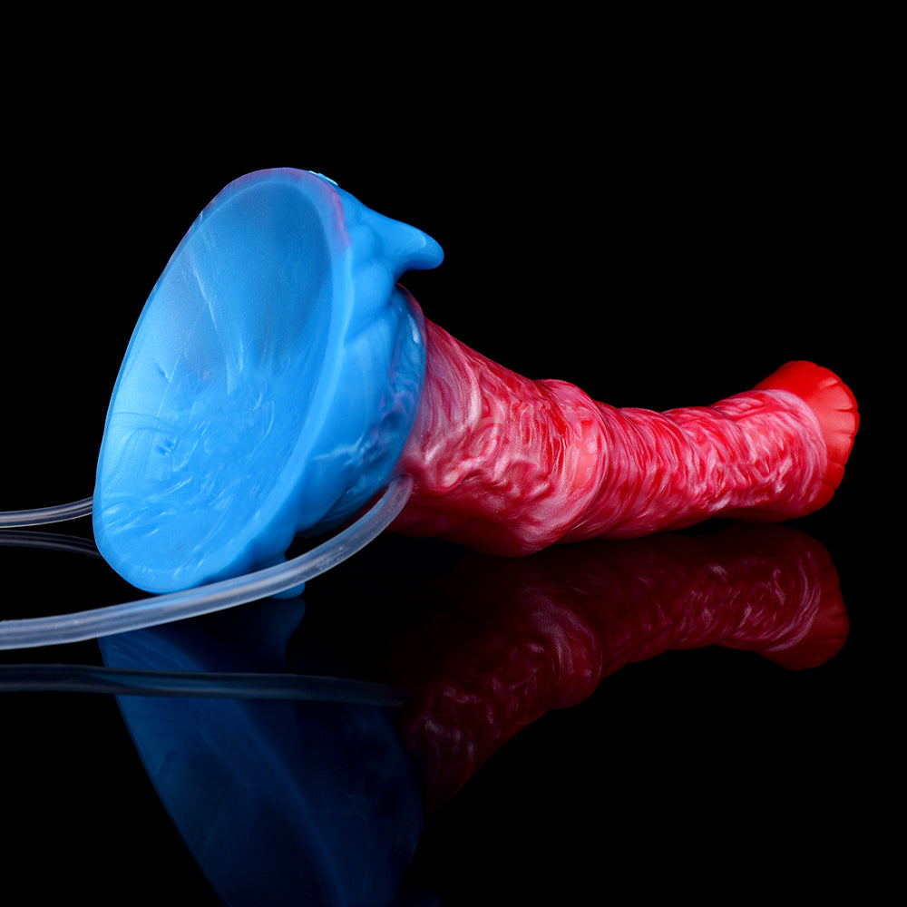 Red inflatable dildo and blue pump nozzle connected by a clear tube