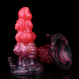 Alien anal plug front view, glossy pink body and dark purple wing-like base
