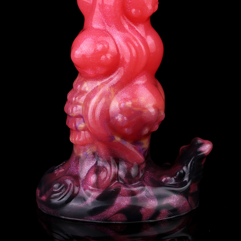 Standing view: glossy red and purple alien butt plug with bulbous suction base