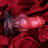 Wolf butt plug close-up: glossy pink and purple body with dark tail end