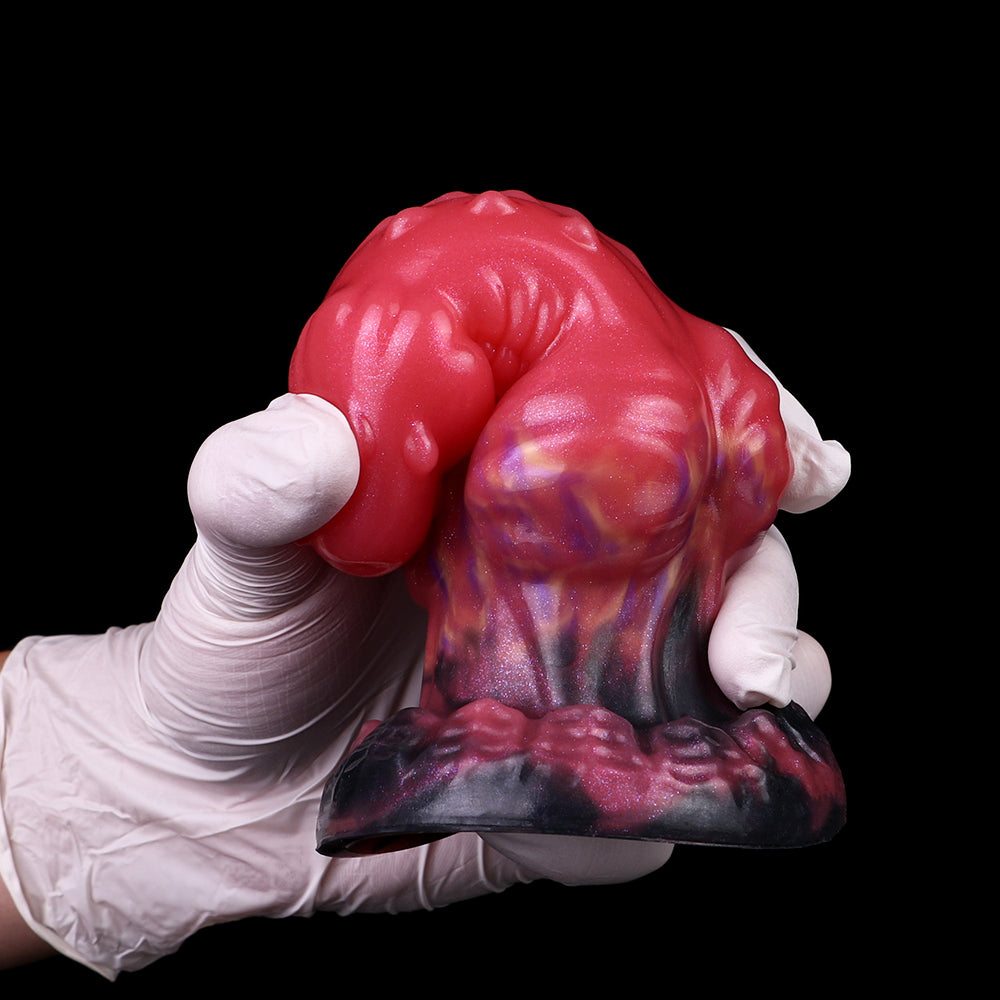 Wolf butt plug: pink/red sculpted plug with colorful rainbow base