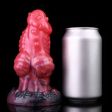Wolf-shaped anal plug, glossy pink with purple swirls and dark tail base