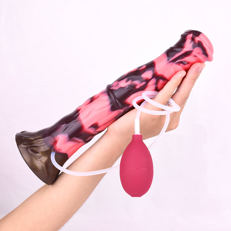 Squirting minotaur-style dildo held with attached tube and red squeeze bulb.