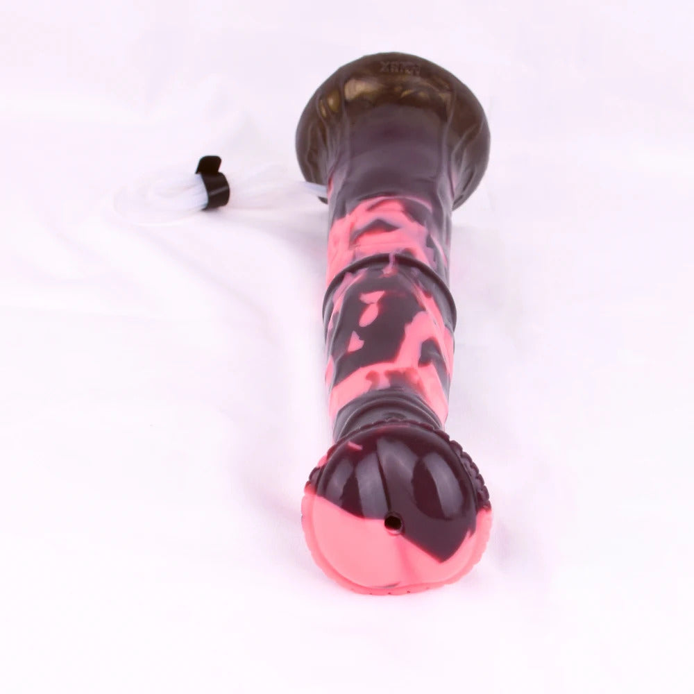 Minotaur dildo end view, black-red marbled head with suction base, open outlet