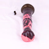 Minotaur dildo end view, black-red marbled head with suction base, open outlet