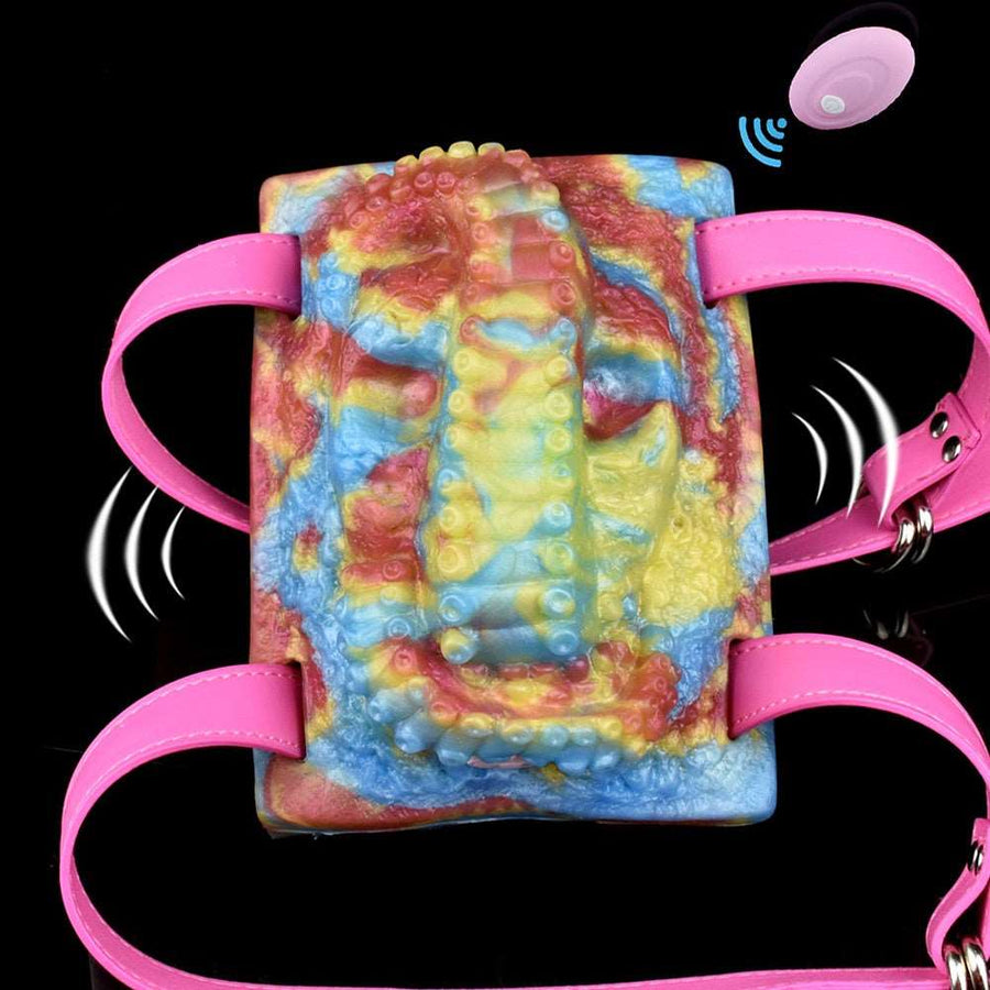 Rainbow octopus sex toy grinder with pink straps and visible vibration icons