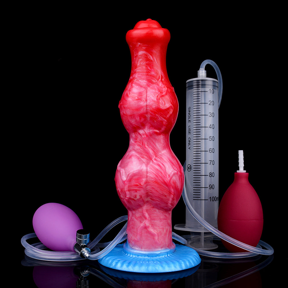 Red inflatable horse-themed dildo with blue base next to measuring syringe and hose
