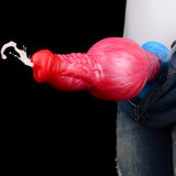 Inflatable knot dildo extended in blue airbag, red-pink textured body