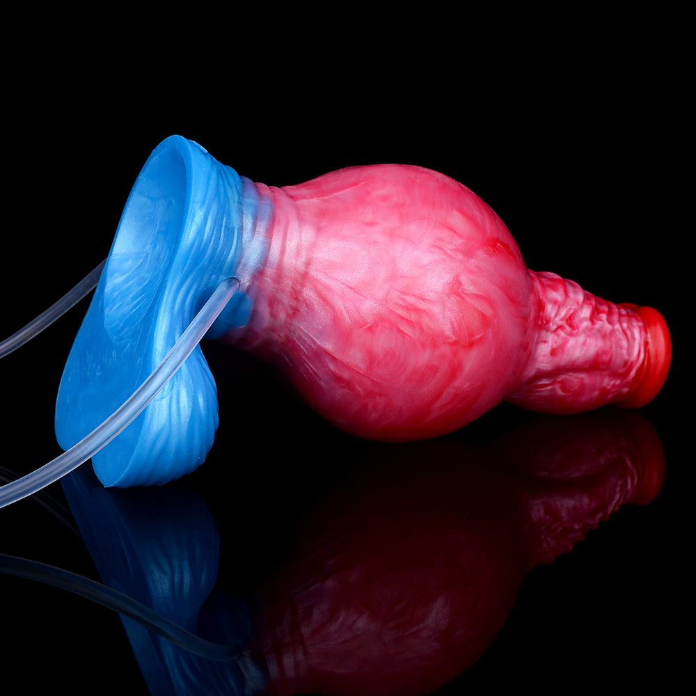 Inflatable knot dildo close-up, red-pink textured body in blue airbag with clear tube