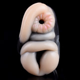 Close-up of the two openings on the gray plush giraffe masturbator