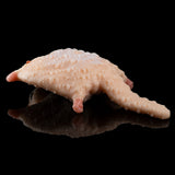 Peach plush cat figure lying on side with textured fur