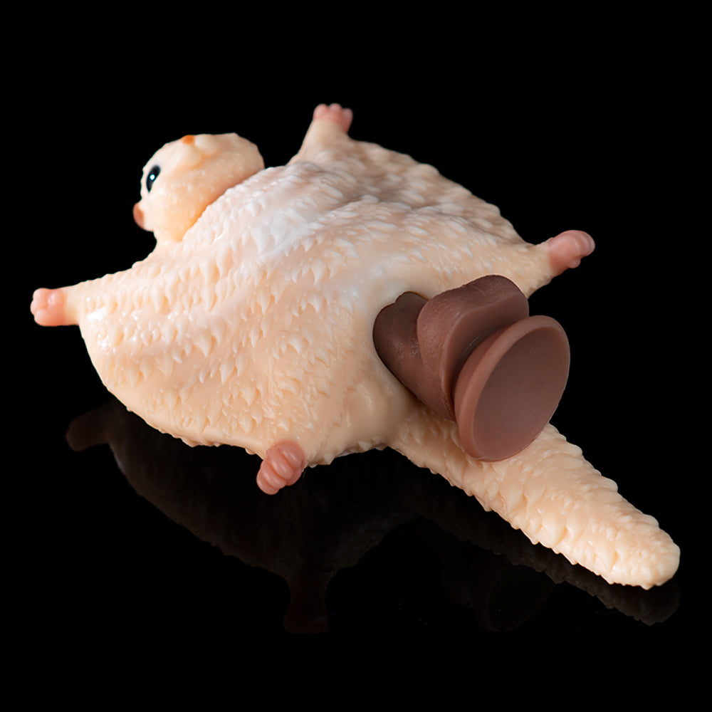 Beige plush animal toy with brown paw pads, orange eye, and extended arms