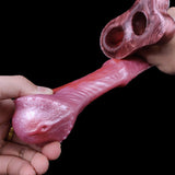 Cock sleeve extender underside view with front tip opening and ribbed texture