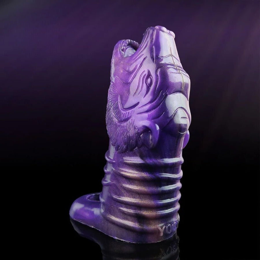 Purple wolf-head penis sleeve with textured ribbed grip and hollow opening