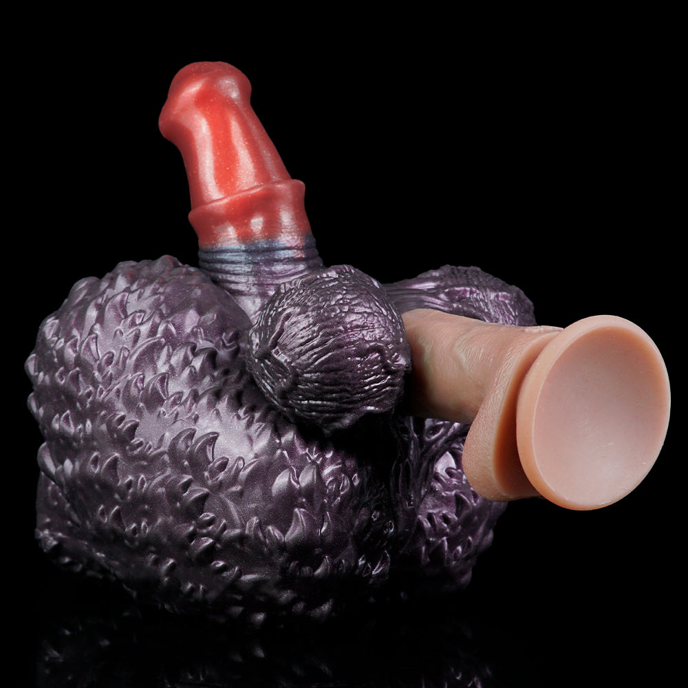 Purple textured hand-shaped toy with red finger and raised red horn on top.